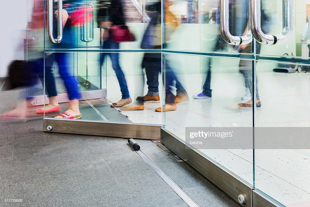 people leaving a business building